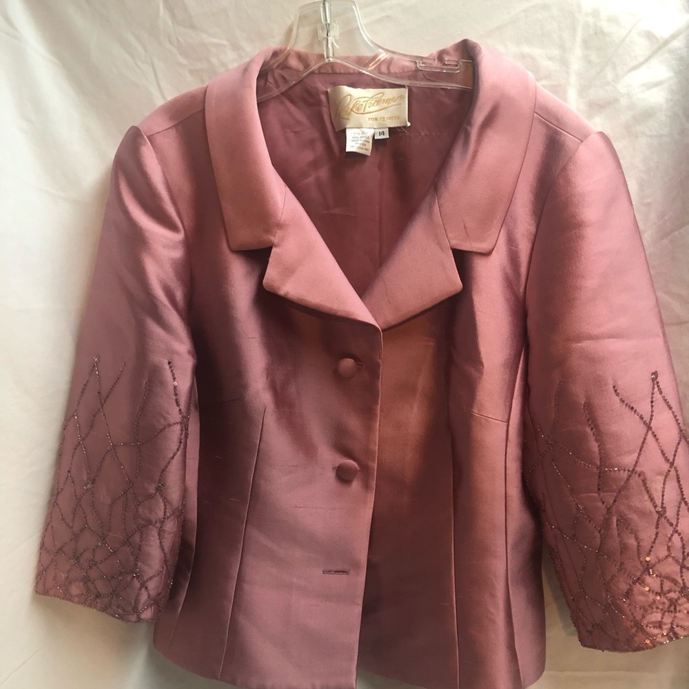 Dress suit. Mother of the bride? Or formal wear